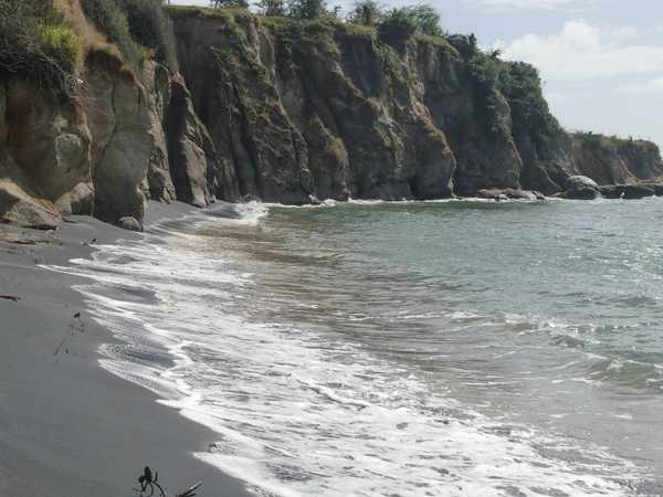 Aganoa black sand beach